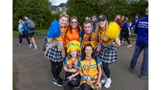 Three supporters walking